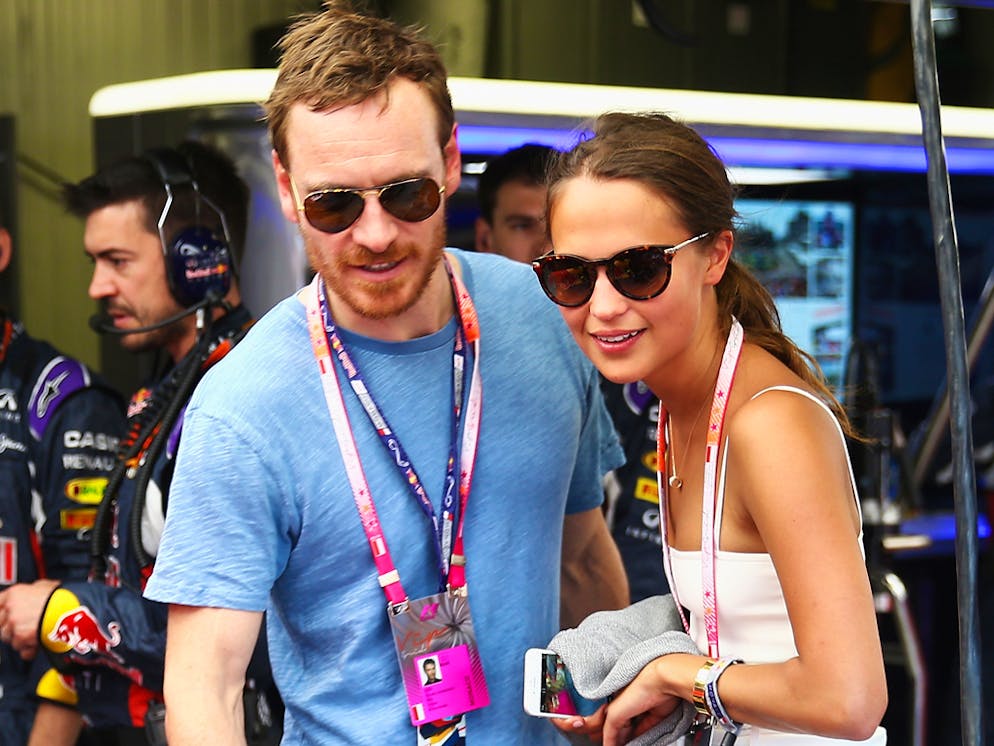 MONTE-CARLO, MONACO - MAY 24:  Actors Alicia Vikander and Michael Fassbender are seen in the Infiniti Red Bull Racing team garage before the Monaco Formula One Grand Prix at Circuit de Monaco on May 24, 2015 in Monte-Carlo, Monaco.  (Photo by Mark Thompson/Getty Images)