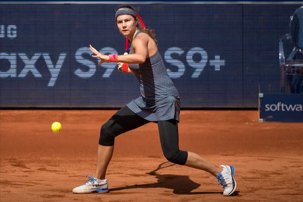 Stefanie Voegele, from Switzerland, in action against Tamara Korpatsch, from Germany, not pictured, at the Samsung Open during the WTA tennis tournament in Lugano, Switzerland, Saturday, April 14, 2018. (KEYSTONE/Ti-Press/Pablo Gianinazzi)