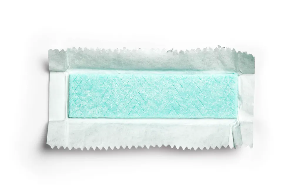 Chewing gum plate wrapped in foil isolated on white background