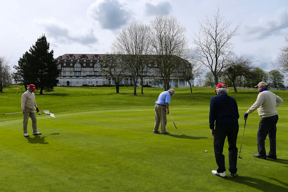Men play golf on a course at the Hotel Barriere L'Hotel du Golf in Deauville, northwestern France, on April 14, 2015.
The Croatian football team will stay at the hotel during the 2016 UEFA European Championship. / AFP PHOTO / CHARLY TRIBALLEAU