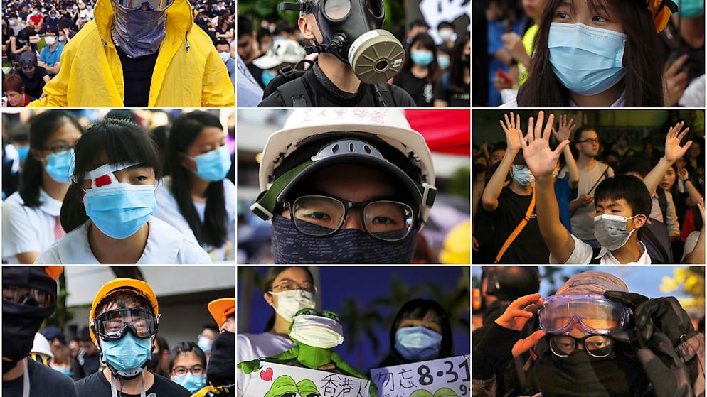 Regierung Hongkongs verbietet Vermummung. Demonstranten in Hongkong tragen Masken und vielfach auch dicht schliessende Brillen, um sich vor Tränengas oder Pfefferspray zu schützen. Ausserdem wollen sie verhindern, dass die Polizei sie identifiziert – etwa mit Software für Gesichtserkennung. (Archivbilder)