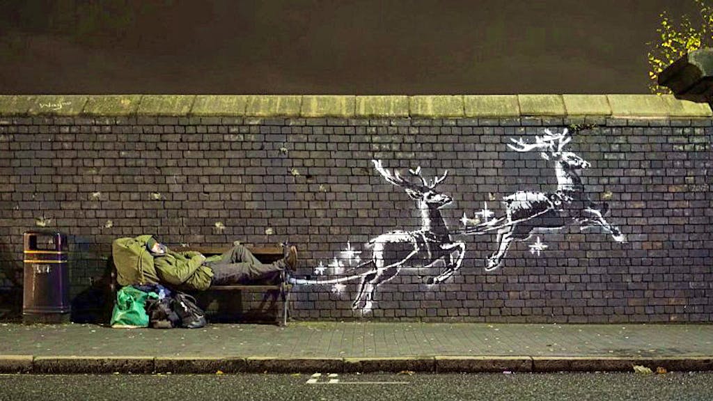 Weihnachtsgruss von Banksy. Rentiere ziehen Obdachlosen statt Weihnachtsmann