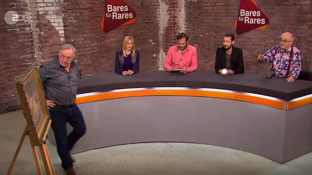 «Bares für Rares»: Horst Lichter und die leicht bekleidete Dame. Und das taten sie: Als die Herren der Händlerrunde das Gemälde sahen, öffneten sie ihre Geldbeutel. «Ohhhhh ja!», ging ein Raunen durch den Raum. «Ein sehr schönes, stimmiges Bild», urteilte Ludwig «Lucki» Hofmaier (r.) fachmännisch.