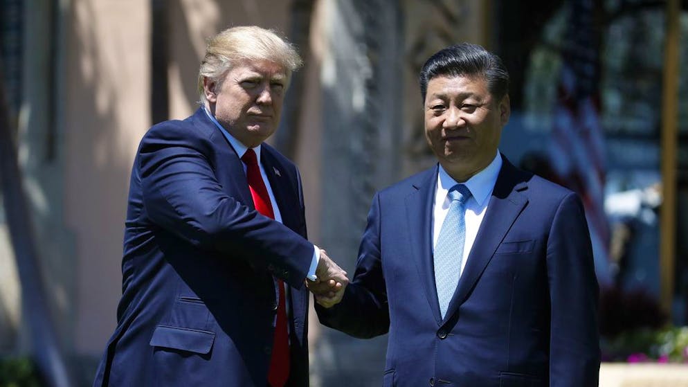 President Donald Trump and Chinese President Xi Jinping shake hands at Mar-a-Lago, Friday, April 7, 2017, in Palm Beach, Fla. (AP Photo/Alex Brandon)