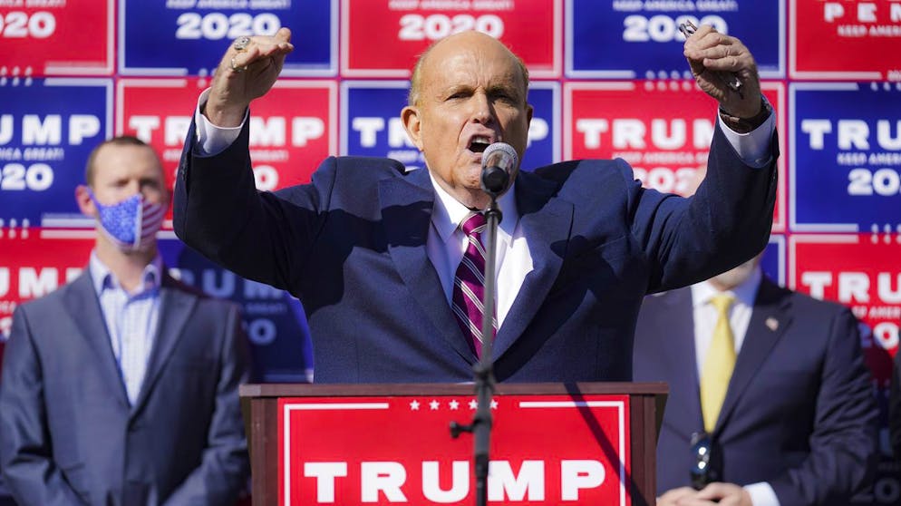 Former New York mayor Rudy Giuliani, a lawyer for President Donald Trump, pauses as he speaks during a news conference on legal challenges to vote counting in Pennsylvania, Saturday Nov. 7, 2020, in Philadelphia.