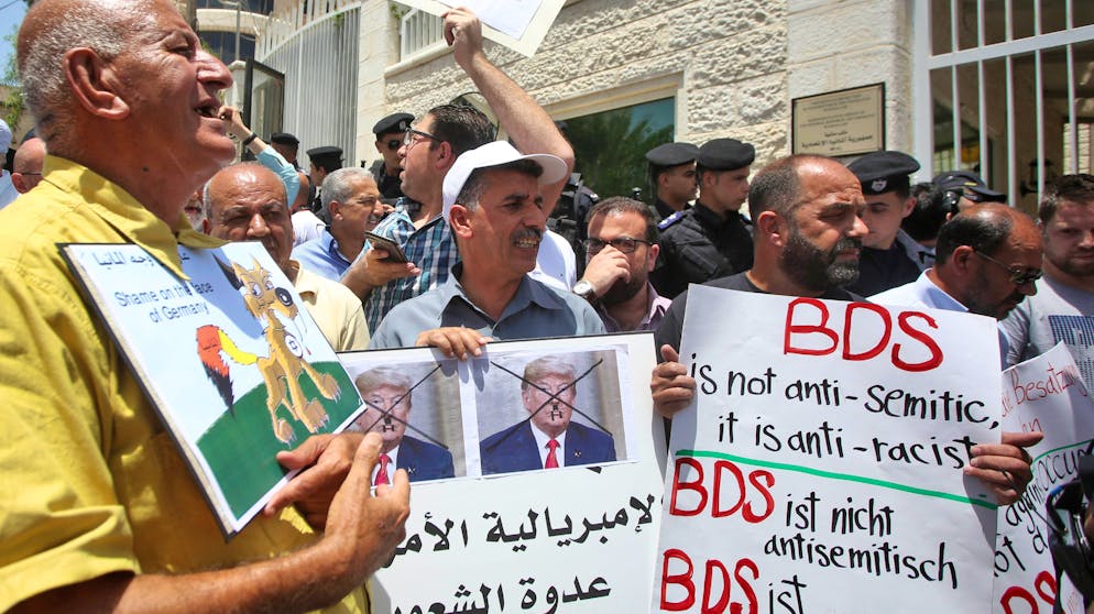 Protesters stage a demonstration outside Germany's Representative Office in Ramallah in the Palestinian West Bank on May 22, 2019, following the Bundestag's (German parliament) condemnation of the Boycott, Divestment, Sanctions (BDS) movement as anti-Semitic. - Germany's parliament condemned on May 17 the movement that demands a boycott of Israel as anti-Semitic, warning that its actions were reminiscent of the Nazis' campaign against Jews. The Bundestag condemnation came with Israel battling a growing chorus to shun the Eurovision Song Contest which Tel Aviv hosted on May 18. (Photo by - / AFP) (Photo credit should read -/AFP via Getty Images)