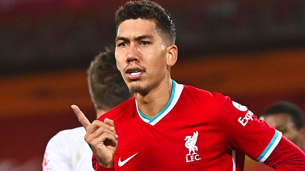 Liverpool's Roberto Firmino celebrates after scoring his sides' third goal during the English Premier League soccer match between Liverpool and Leicester City at Anfield Stadium in Liverpool, England.  Saturday, November 22, 2020 (Laurence Griffiths / Pool via AP)