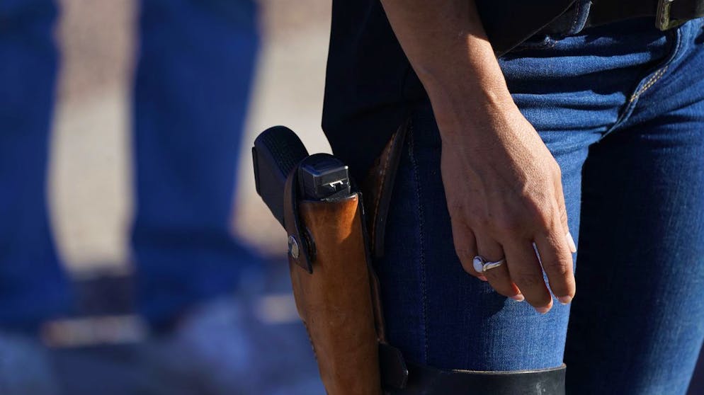 FILE - In this Sept. 4, 2020, file photo Lauren Boebert, the Republican candidate for the U.S. House of Representatives seat in Colorado's vast 3rd Congressional District, during a freedom cruise staged by her supporters in Pueblo West, Colo. An aide to Boebert, a firearms-toting congresswoman-elect, says she has already asked Capitol Police about carrying her weapon on Capitol grounds once sheâÄ™s sworn into office. (AP Photo/David Zalubowski, File)