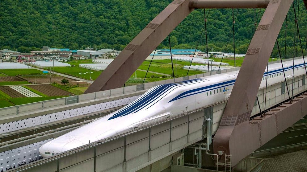 epa03872351 A JR Tokai or Central Japan Railway Co. handout photo dated 03 July 2013 and released on 18 September 2013 shows Central Japan Railway Co.'s L0 (zero) series magnetic levitated train running during a high-speed test run in Tsuru, Yamanashi Prefecture, west of Tokyo, Japan. Central Japan Railway Co. announced on 18 September 2013 it will build six stations for the maglev trains to start its service between Tokyo and Nagoya, central Japan in 2027. The train is designed to run at speed of 500 km per hour and will connect 366km journey between Tokyo and Nagoya in about 40 minutes in stead of one hour 41 minutes by present fastest Nozomi Shinkansen bullet train. EPA/JR TOKAI / HANDOUT HANDOUT EDITORIAL USE ONLY/NO SALES