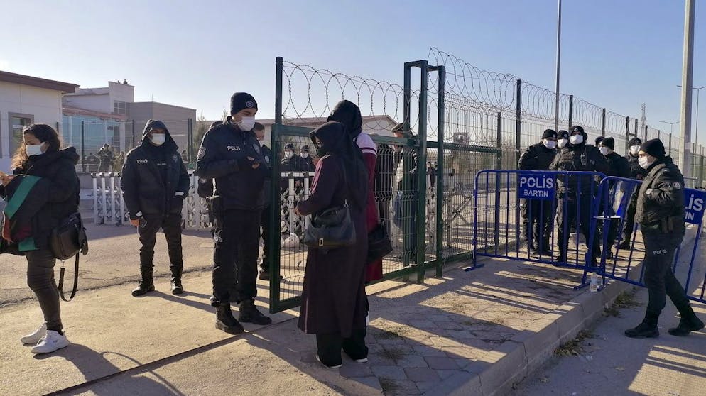 Riot police officers stand at the entrance of a courthouse before the trial of 475 defendants, including generals and fighter jet pilots, in Sincan, Ankara, Turkey, Thursday, Nov. 26, 2020. A Turkish court sentenced several military and civilian personnel at an air base to life prison sentences on Thursday, proclaiming them guilty of involvement in a failed coup attempt in 2016, the state-run news agency reported. (AP Photo)