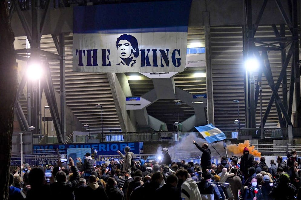 epa08842905 Napoli fans gather at the San Paolo stadium to pay tribute to football legend Maradona in Naples, Italy on November 25, 2020 (released November 26).  Diego Maradona died on November 25 after an EPA / CIRO FUSCO heart attack