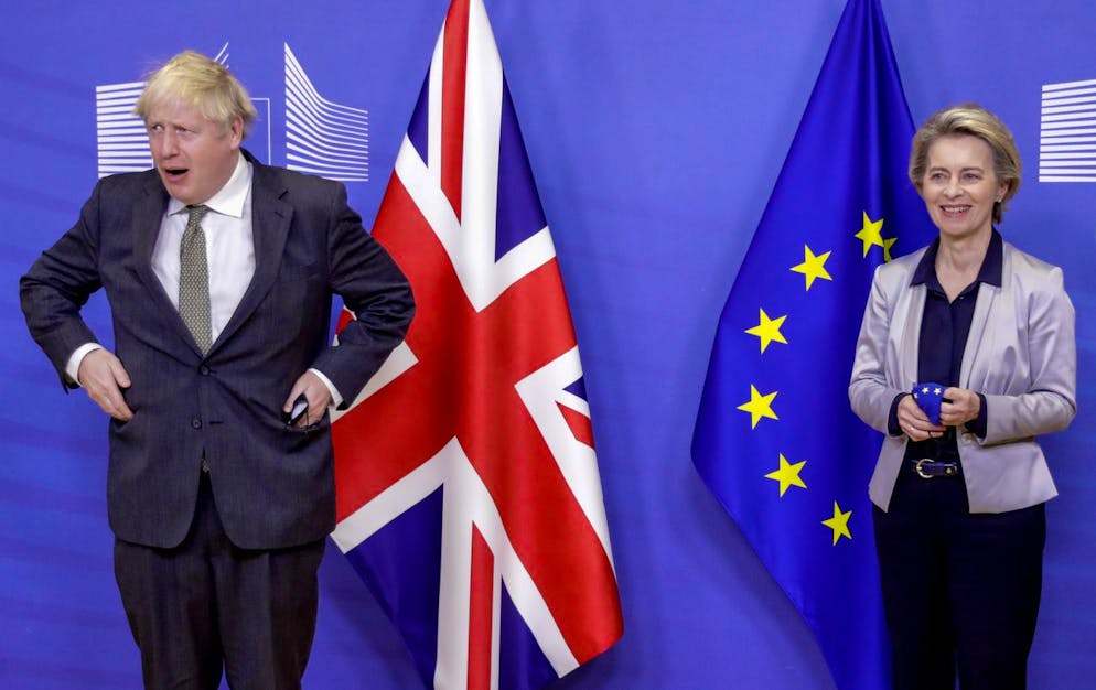European Commission President Ursula von der Leyen, right, welcomes British Prime Minister Boris Johnson prior to a meeting at EU headquarters in Brussels, Wednesday, Dec. 9, 2020. Leaders of Britain and the EU meet Wednesday for a dinner that could pave the way to a post-Brexit trade deal, or tip the two sides toward a chaotic economic rupture at the end of the month. (Olivier Hoslet, Pool via AP)