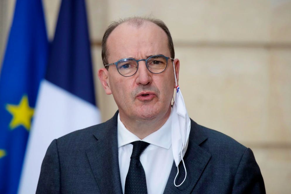 epa08872340 French Prime Minister Jean Castex, with a protective face mask hanging off his ear, speaks during a news conference after the weekly cabinet meeting discussions over a bill to fight what Macron has called Islamist separatism at the Elysee Palace in Paris, France, 09 December 2020. EPA/CHARLES PLATIAU / POOL MAXPPP OUT