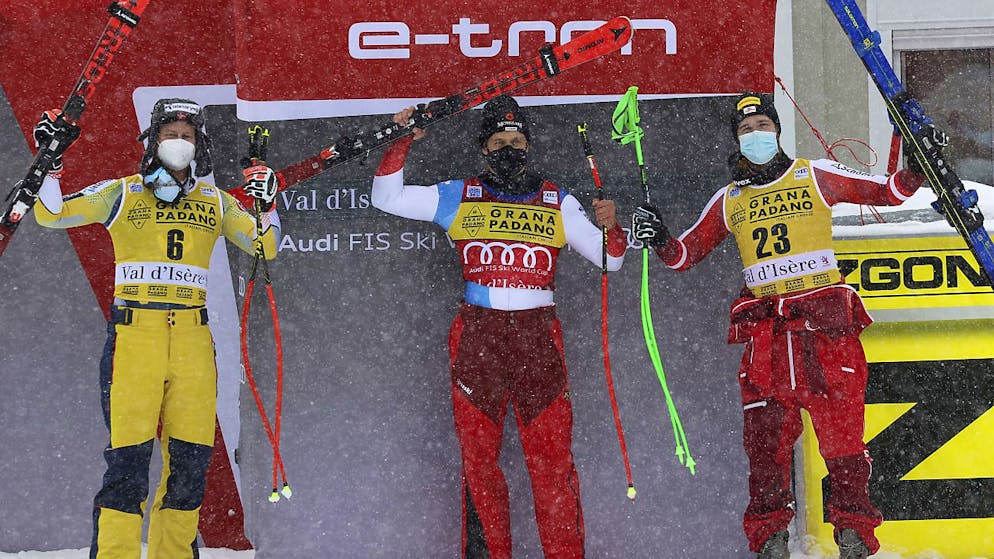 Das Siegerpodest des Super-G in Val d'Isère: Mauro Caviezel umrahmt vom zweitklassierten Norweger Adrian Sejersted (links) und dem Österreicher Christian Walder