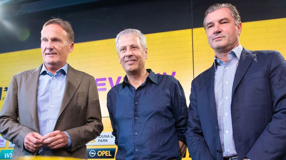 06.07.2018, North Rhine-Westphalia, Dortmund: Lucien Favre (M), Borussia Dortmund's new coach, stands between managing director Hans-Joachim Watzke and sporting director Michael Zorc (r).  (KEYSTONE / DPA / Bernd Thissen)