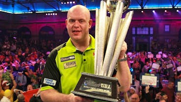 epa07257608 Dutch Michael van Gerwen celebrates with the trophy after winning the PDC World Championship final match against British Michael Smith at the Alexander Palace in North London, Britain, 01 January 2019. EPA/SEAN DEMPSEY