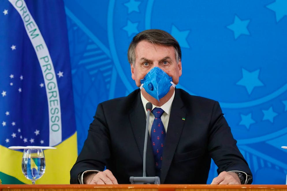 epa08310757 A handout picture made available by the Presidency of Brazil shows Brazilian President Jair Bolsonaro during a press conference in Brasilia, Brazil, 20 March 2020. Bolsonaro insisted that the Brazilian economy cannot be paralyzed by the measures adopted by regional and municipal governments to stop the advance of the coronavirus and asked that regional leaders think of the country as a whole. EPA/Isac Nobrega / HANDOUT HANDOUT EDITORIAL USE ONLY/NO SALES