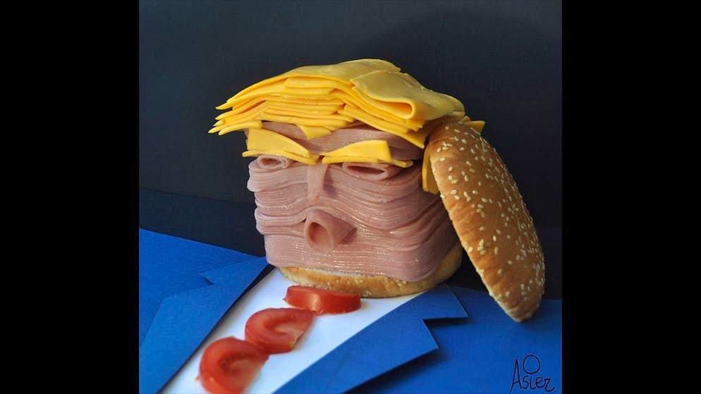 Trump, Merkel e compagnia: dei ritratti appetitosi. Non ha l'aria appetitosa? In questo ritratto, il presidente statunitense Donald Trump ha guance gustose e capelli grassi – è prosciutto e formaggio, dopotutto.