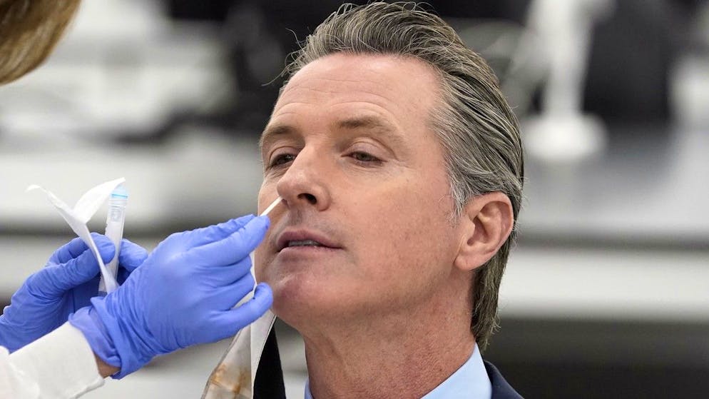 California Governor Gavin Newsom receives a COVID-19 test at a new facility on Friday, October 30, 2020, in Valencia, California.  Newsom announced the new $ 120 million 134,000-square-foot coronavirus testing facility in Valencia on Friday.  The state is working with corporate partner PerkinElmer to run the lab that will allow the state to process an additional 150,000 COVID-19 tests per day.  (AP Photo / Marcio José Sánchez, Pool)