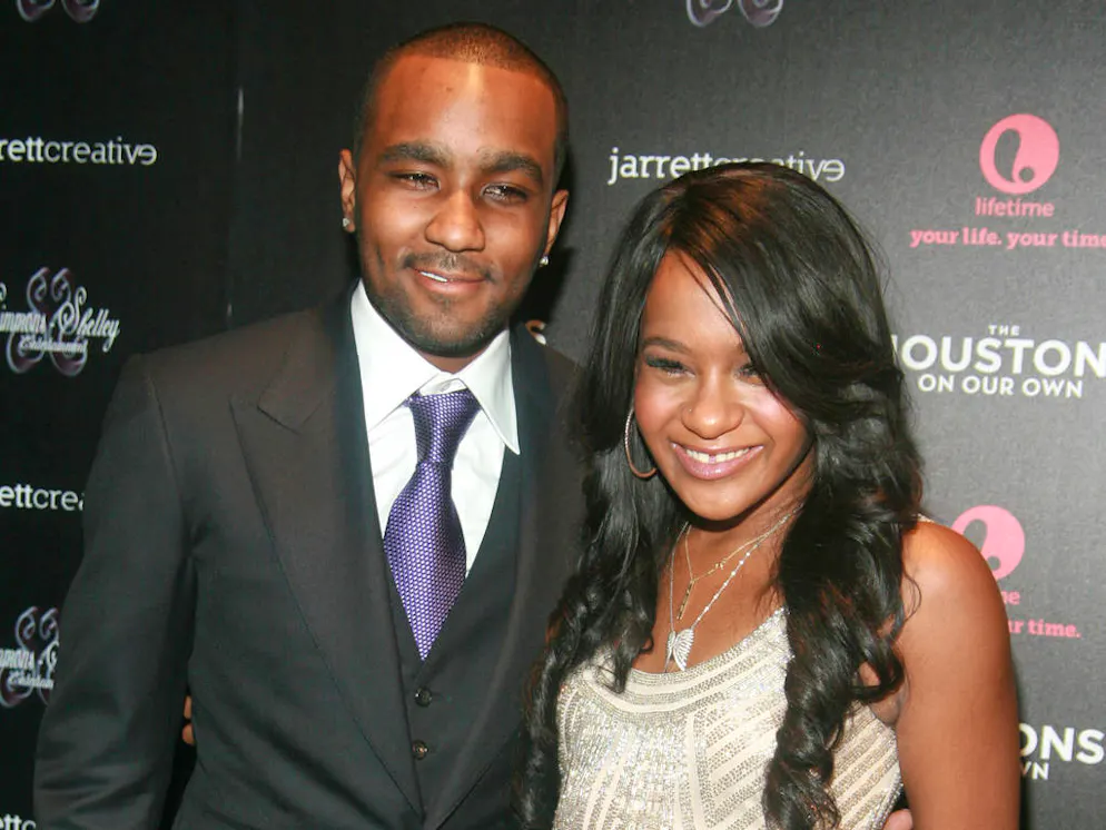 * BOBBI KRISTINA BROWN IS ENGAGED
WHITNEY HOUSTON's daughter BOBBI KRISTINA BROWN is engaged to marry her boyfriend NICK GORDON.
  The 20 year old grew close to Gordon, who was informally adopted by her mum when he was 12, after the death of the superstar in 2012, and now the young couple is set to wed.
  Announcing the news in a post on her official Facebook.com page, she writes, "YES, we me nick (sic) are engaged."
  And she took aim at critics of the romance, adding, "I'm tired of hearing people say 'eww your (sic) engaged to your brother or if Whitney was still alive would we be together or would she approve of this.' Let me clear up something, we aren't even real brother and sister, nor is he my adoptive brother. My mom never adopted him. In fact, mommy was the one who even said that she knew that we were going to start dating. My mom knows me better than any of you.
  "A lot of yall are saying that yall are only saying this all out of love. Which is bull because if that was so, all you would want is for me to be happy (sic).
  "People need to seriously stop judging my relationship. Pretty sure it's my own decision who I want to be with. Yes, my relationship may not be perfect. We will have rough patches, just like every other relationship. And we have had our rough patches. You may or may not agree with my relationship. You may or may not respect it. Judge me, go ahead. Your opinions are yours and mine are mine. It is my life and not yours. The decisions I make have nothing to do with you."
  Gordon and Brown, whose father is singer Bobby Brown, has sparked engagement rumours in the past - she was photographed on two separate occasions wearing a diamond sparkler on her ring finger, but her representative denied the claims both times. (MC/FCB/KL)

Featuring: Nick Gordon and Bobbi Kristina Brown
Where: New York City, United States
When: 22 Oct 2012
Credit: WENN