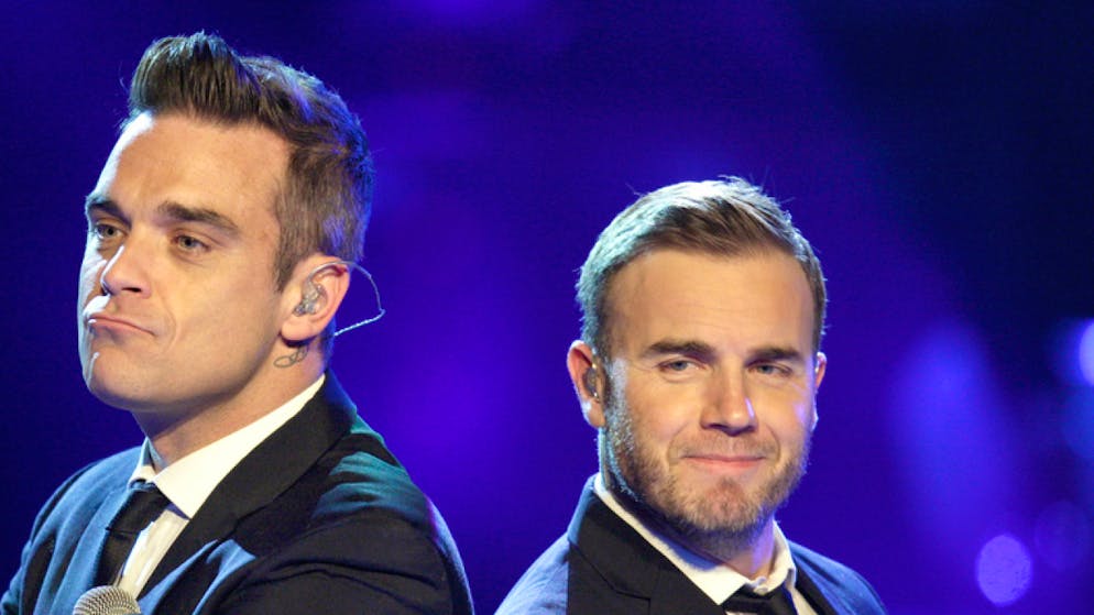Robbie Williams (links) und Gary Barlow (rechts) feierten einst mit Take That Erfolge mit ihrem Song «Shame». Jetzt haben sie bei Instagram den Song im Online-Duett gesungen. (Archivbild)