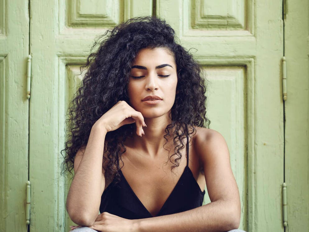 Portrait of young woman with eyes closed sitting in front of an entrance door

When: 23 Feb 2018
Credit: Javier SÃ¡nchez Mingorance/Westend61/Cover Images