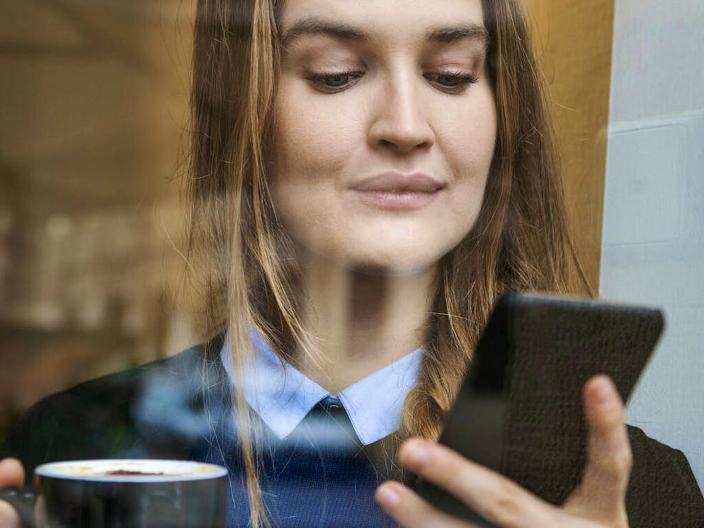 Smiling young woman in coffee shop with cup of coffee looking at smartphone
When: 14 Dec 2016
Credit: Valentina Barreto/Westend61/Cover Images