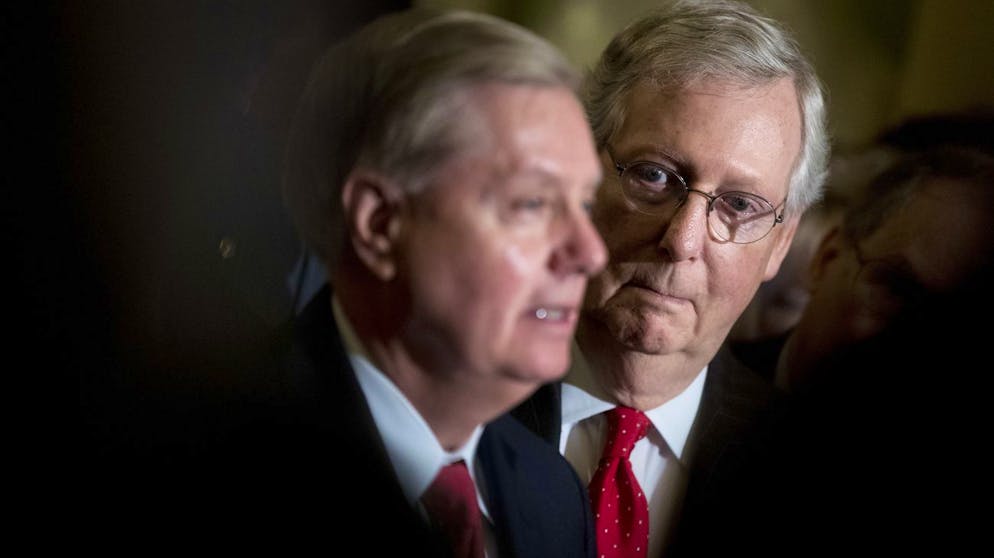 Sen. Lindsey Graham, R-S.C., flanked by Senate Majority Leader Mitch McConnell, R-Ky., right, speaks to reporters as they faced assured defeat on the Graham-Cassidy bill, the GOP's latest attempt to repeal the Obama health care law, at the Capitol in Washington, Tuesday, Sept. 26, 2017, in Washington. The decision marked the latest defeat on the issue for President Donald Trump and Mitch McConnell in the Republican-controlled Congress. (AP Photo/Andrew Harnik)