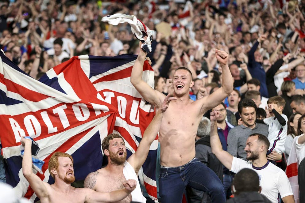 England fans celebrate after Harry Kane scored his side's 2nd goal during the Euro 2020 soccer championship semifinal match between England and Denmark at Wembley stadium in London, Wednesday, July 7, 2021. (AP Photo/Carl Recine, Pool)