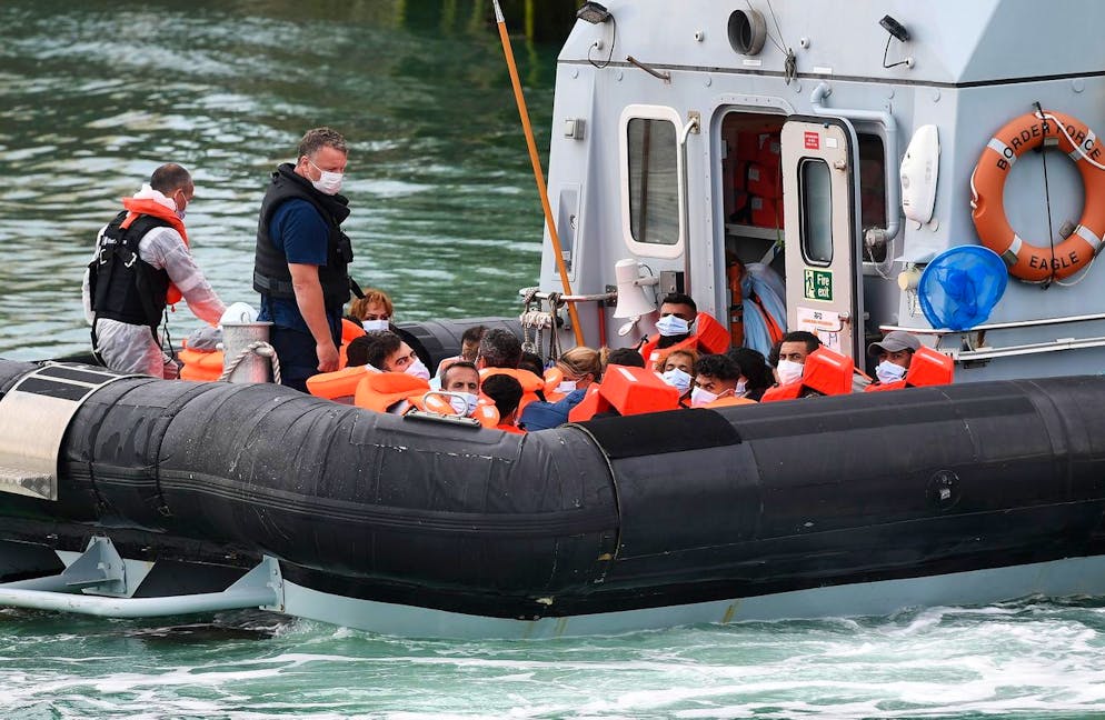 epa08612523 A Border Force vessel brings in migrants found off the coast of Dover in Dover, Kent, Britain, 19 August 2020. Britain and France are continuing ongoing talks to try to resolve the migrant crisis in the English Channel. Migrants from Syria and other countries are continuing to arrive along the coast of the UK in their quest for asylum. EPA/ANDY RAIN
