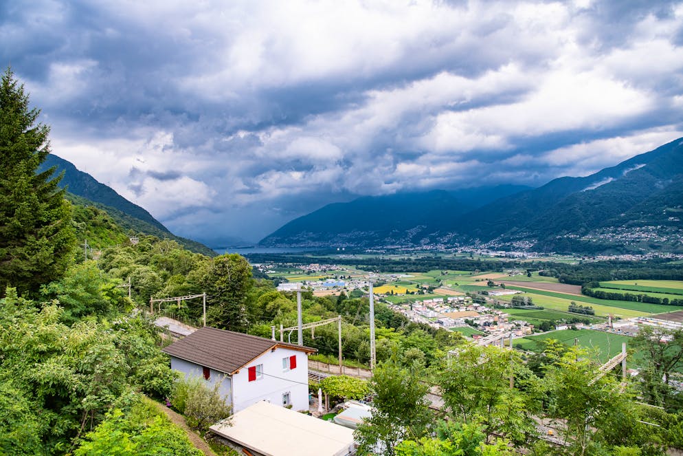 Haevy clouds hang over the Magadino plain, Southern Switerland, Tuesday, July 13, 2021. Violent thunderstorms with heavy rain, hailstorms and gale-force winds passed over Switzerland during the night on Tuesday. .(KEYSTONE/Ti-Press/Elia Bianchi)