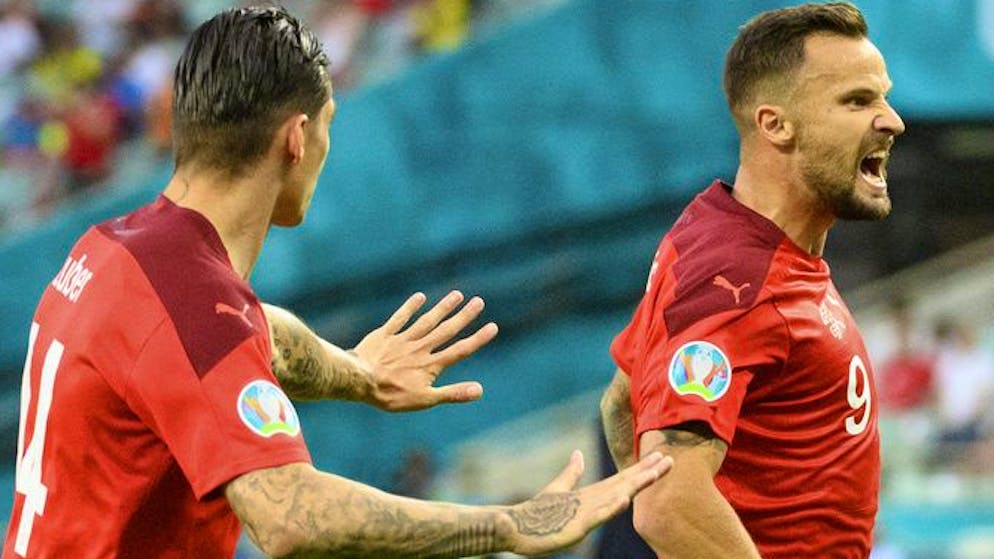 Switzerland's forward Haris Seferovic, right, celebrates the first goal with Switzerland's midfielder Steven Zuber, left, during the Euro 2020 soccer tournament group A match between Switzerland and Turkey at the Olympic stadium, in Baku, Azerbaijan, Sunday, June 20, 2021. (KEYSTONE/Jean-Christophe Bott)