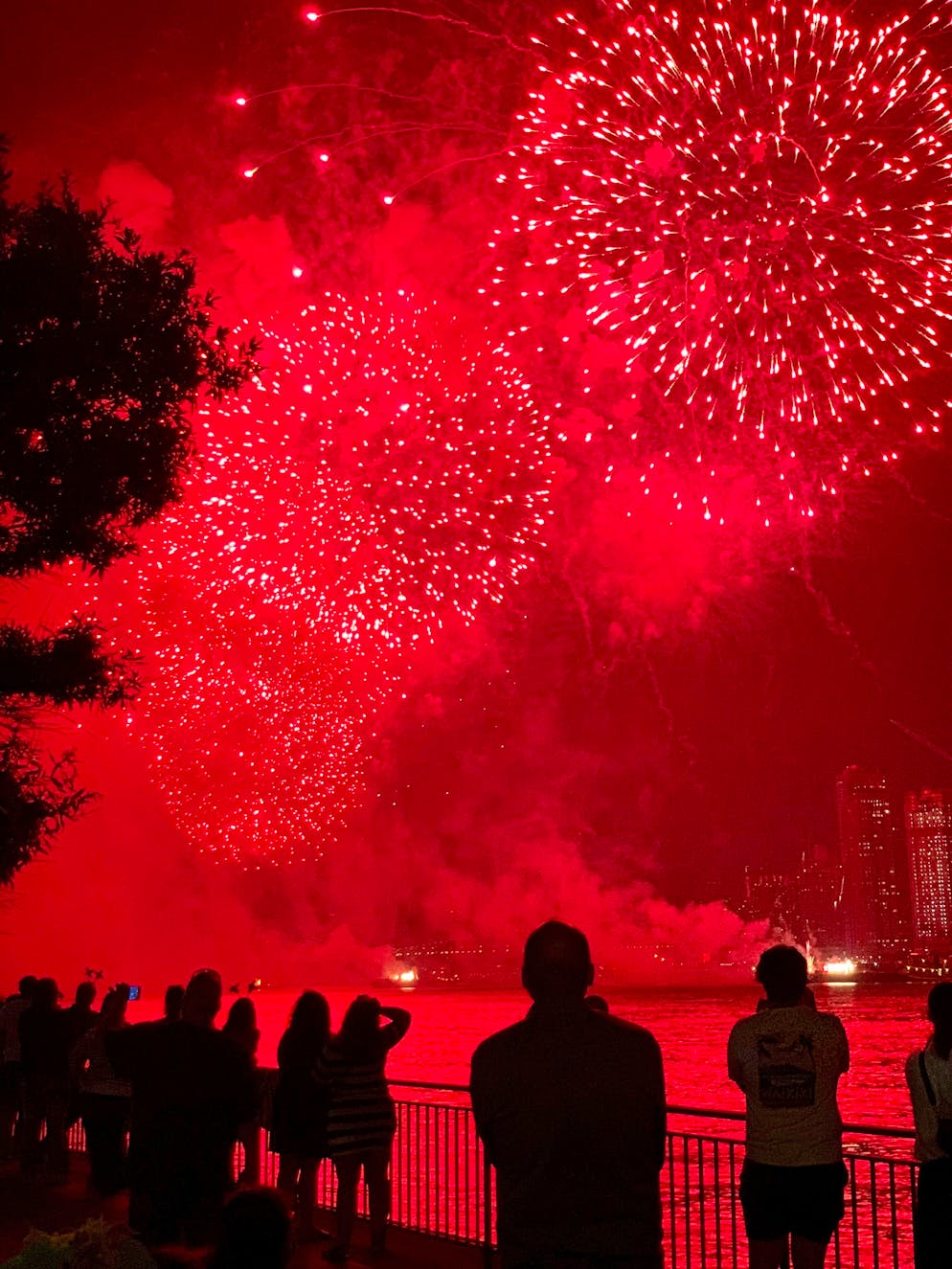 People watch the Macy's 4th of July Fireworks show along the East River, late Sunday, July 4, 2021, in New York. (AP Photo/Pamela Hassell)