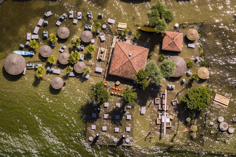 A flooded terrace is pictured in Estavayer-le-Lac on the shore of lake Neuchatel Switzerland, Monday, July 19, 2021. (KEYSTONE/Valentin Flauraud)