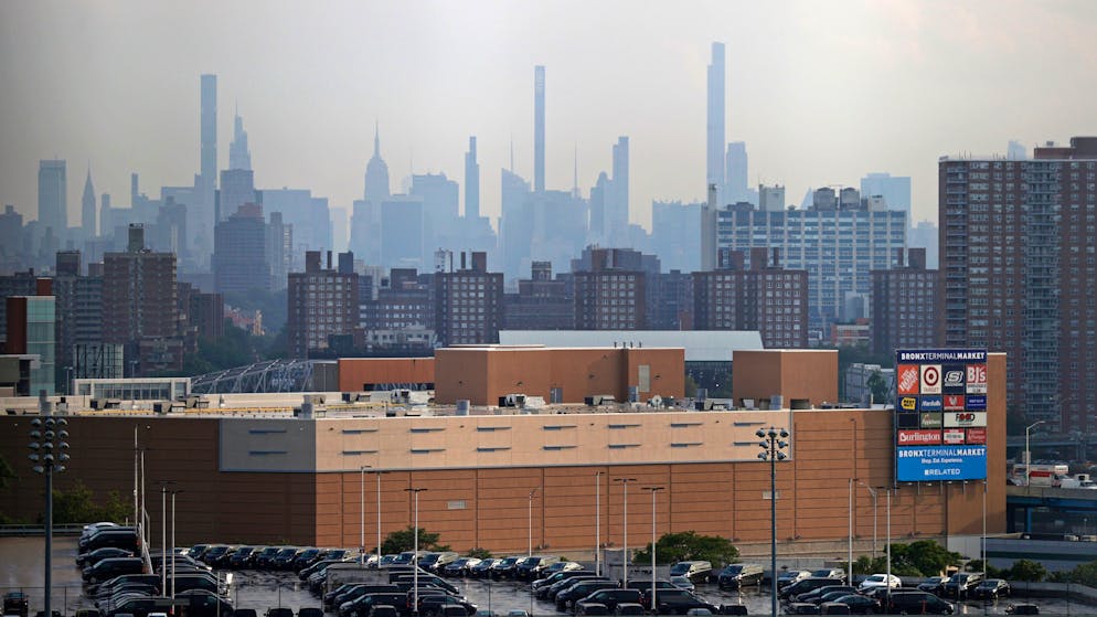 Manhattan is seen from Yankee Stadium through a haze of smoke before a baseball game between the Philadelphia Phillies and the New York Yankees, Wednesday, July 21, 2021, in New York. Wildfires in the American West, including one burning in Oregon that's currently the largest in the U.S., are creating hazy skies as far away as New York as the massive infernos spew smoke and ash into the air in columns up to six miles high. (AP Photo/Adam Hunger)