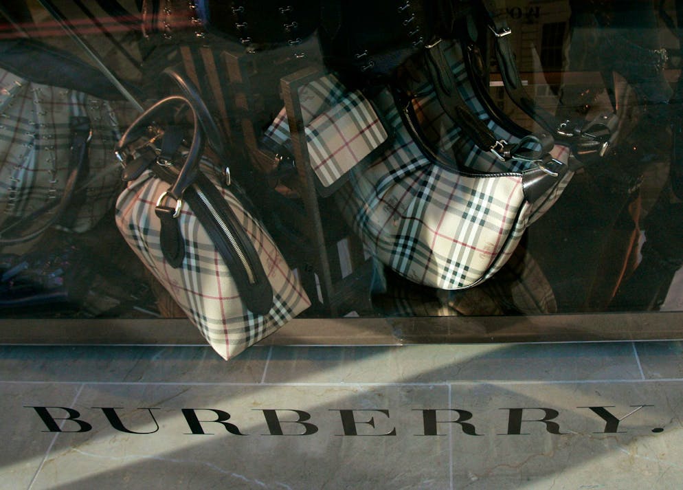 FILE- A Burberry store window displaying some of their trademark goods in London, in this file photo dated Wednesday, Nov. 19, 2008. Burberry declared Tuesday Nov. 16, 2010, first-half profit was 83.1 million pounds ($133 million), compared with 56.8 million pounds a year earlier, and the company's shares were down 0.7 percent at 1,013 pence on the London Stock Exchange in early trading Tuesday. (AP Photo/Alastair Grant, FILE)