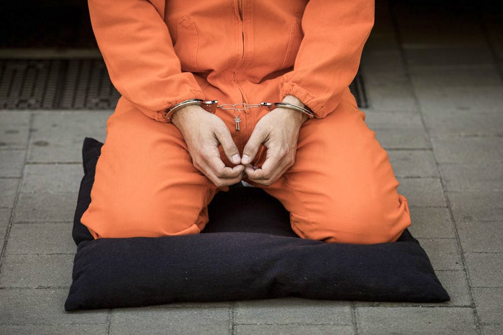 A protester, depicting a detainee of the US detention facility at Guantanamo Bay, Cuba, stages a demonstration with others during a NATO summit in Brussels, Monday, June 14, 2021. U.S. President Joe Biden is taking part in his first NATO summit, where the 30-nation alliance hopes to reaffirm its unity and discuss increasingly tense relations with China and Russia, as the organization pulls its troops out after 18 years in Afghanistan. (AP Photo/Valentin Bianchi)