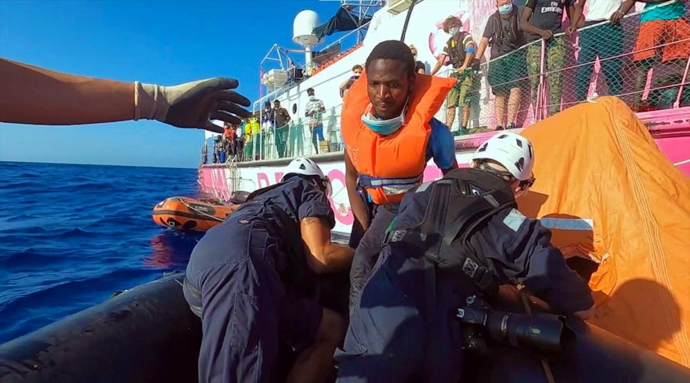 epa08639757 A handout grab photo made available from a video provided by the NGO 'Sea-Watch 4' shows rescued migrants and heading to Palermo, Italy, 01 September 2020. According to reports, the charity vessel rescued 353 people and will be disembarked in Palermo after a ship quarantine. EPA/Ufficio Stampa Sea Watch HANDOUT HANDOUT EDITORIAL USE ONLY/NO SALES