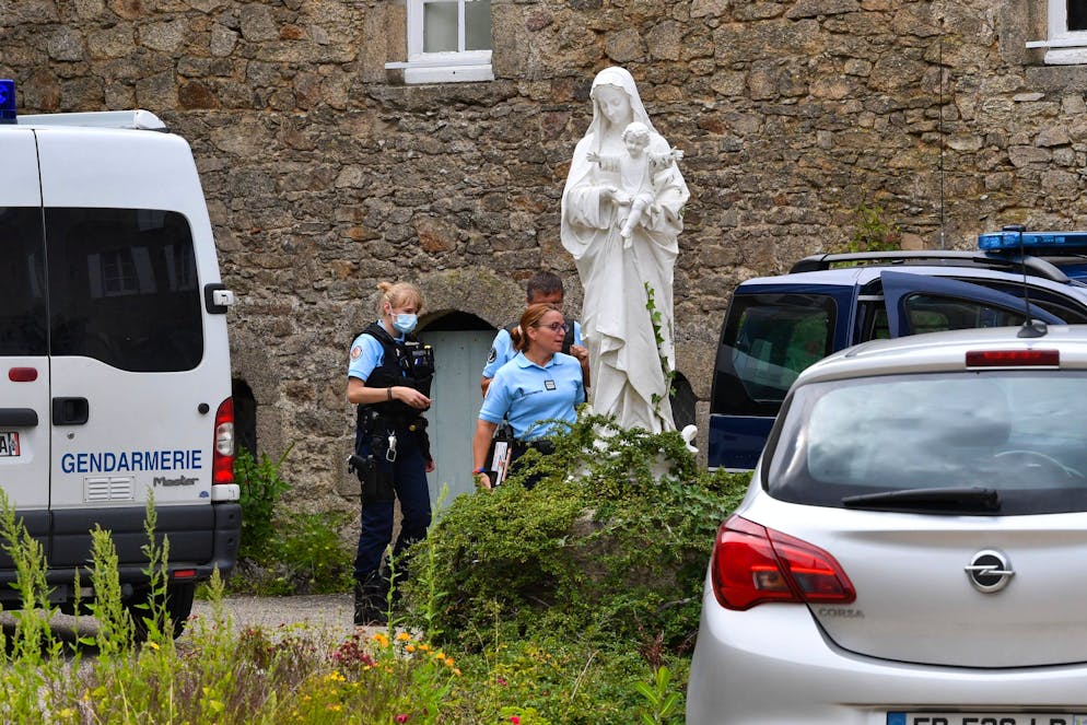 epa09407424 French gendarmes stand in front of the community of the 'Montfortain' missionary brothers where a priest was found dead in Saint Laurent sur Sevre, western France, 09 August 2021. The prosecutor announced that a man of Rwandan nationality is in custody at the Gendarmerie and accused himself of the murder. The suspect was under judicial control after being accused of having burned down Nantes Cathedral in July 2020. EPA/Joel Le Gall/PQR/Ouest France FRANCE OUT / SHUTTERSTOCK OUT