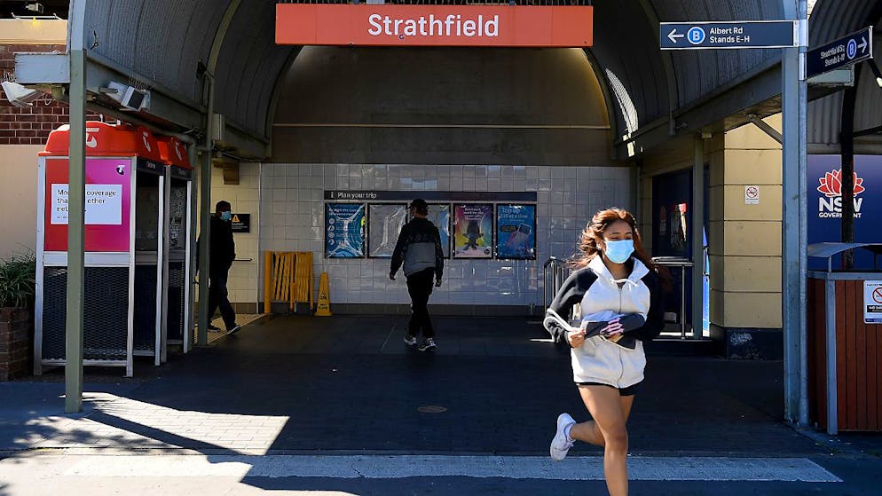 People are seen in Strathfield, Sydney, Friday, August 13, 2021. More than 80 per cent of the NSW population is now in lockdown as the state struggles to stop the spread of the Delta COVID-19 strain beyond Greater Sydney and into the regions. (AAP Image/Dan Himbrechts) NO ARCHIVING