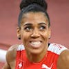 Mujinga Kambundji of Switzerland smiles after crossing the finish line of the women's athletics 200m final at the 2020 Tokyo Summer Olympics in Tokyo, Japan, on Tuesday, August 03, 2021. (KEYSTONE/Laurent Gillieron)