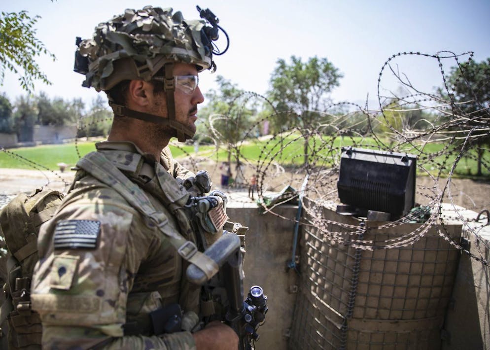 In this image provided by the U.S. Army, aq paratrooper assigned to B Company, 2nd Battalion, 501st Parachute, Infantry Regiment, 1st Brigade Combat Team, 82nd Airborne Division conducts security at Hamid Karzai International Airport in Kabul, Afghanistan, Saturday, Aug. 28, 2021. (Master Sgt. Alexander Burnett/U.S. Army via AP)