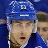 FILE - At left, in a Feb. 4, 2017, file photo, Philadelphia Flyers' Mark Streit plays during an NHL game against Tampa, in Tampa, Fla. At right, in a Feb. 23, 2016, file photo, Tampa Bay Lightning's Valtteri Filppula, of Finland, looks to pass against the Arizona Coyotes during the second period of an NHL hockey game in Tampa, Fla. The Tampa Bay Lightning acquired defenseman Mark Streit from the Philadelphia Flyers for center Valtteri Filppula and two draft picks. Philadelphia receives a 2017 fourth-round pick and conditional seventh-round pick in the trade. The teams announced the deal Wednesday afternoon, March 1, 2017, shortly before the trade deadline. (AP Photo/File)