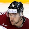 Latvia's Kaspars Daugavins drives the puck, during the IIHF 2015 World Championship preliminary round game Switzerland vs Latvia, at the O2 Arena, in Prague, Czech Republic, Wednesday, May 6, 2015. (KEYSTONE/Salvatore Di Nolfi)