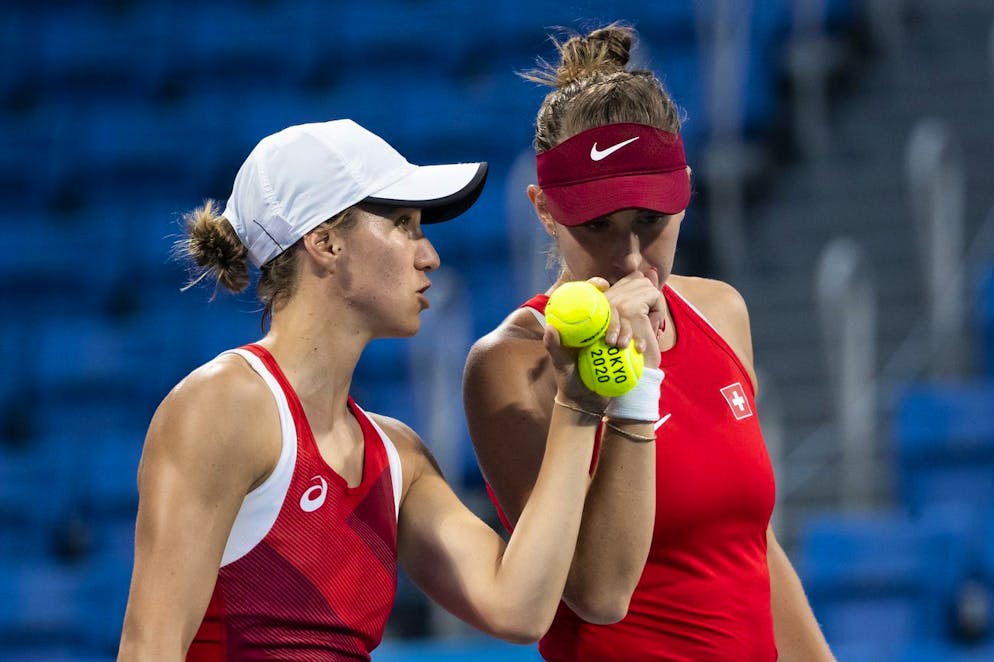 Belinda Bencic, right, and Viktorija Golubic during the women's doubles tennis quarterfinal match against Ellen Perez and Samantha Stosur of Australia, at the 2020 Tokyo Summer Olympics in Tokyo, Japan, on Wednesday, July 28, 2021. (KEYSTONE/Peter Klaunzer)
