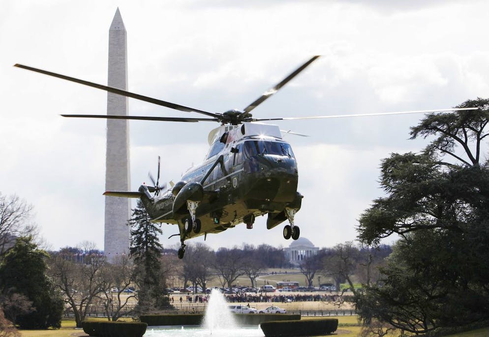 ** FILE ** In this Feb. 16, 2009, file photo, with the Washington Monument and Jefferson Memorial seen at rear, Marine One helicopter, with President Barack Obama on board, prepares to land on the South Lawn of the White House in Washington. President Barack Obama never had a helicopter, which he says might explain why he's perfectly happy with the current White House fleet and doesn't need a more costly one. At the conclusion of a fiscal summit Monday, Feb. 23, 2008, Obama faced questions from Republican and Democratic lawmakers, including his former presidential rival, Sen. John McCain. (AP Photo/Charles Dharapak)