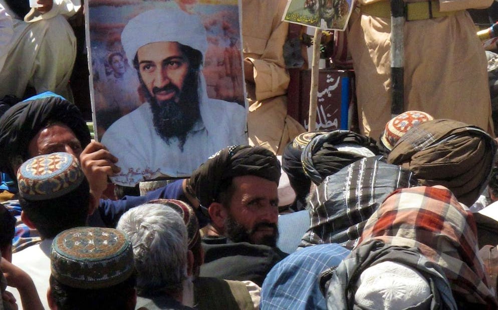 epa02719797 Supporters of Islamic political party Jamiat Ulma-e-Islam Nazaryati, attend a protest against the US raid that killed Osama Bin Laden, in Kuchlak, on the outskirts of Quetta, Pakistan on 06 May 2011. Al-Qaeda founder and leader Osama Bin Laden was killed on 01 May in Abbottabad, Pakistan by US forces. EPA/WAHEED KHAN