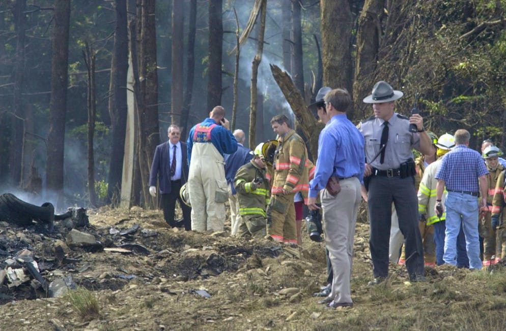Firefighters and emergency personnel investigate the scene of a fatal crash involving a United Airlines Boeing 757 with at least 45 passengers Tuesday morning, September 11, 2001 near Shanksville, Pa. (KEYSTONE/AP Photo/ Tribune-Democrat/David Lloyd)