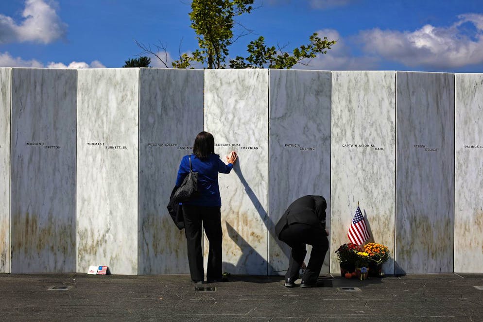 FILE- In this Sept. 11, 2015 file photo, a visitor pauses at the Wall of Names after a Service of Remembrance at the Flight 93 National Memorial in Shanksville, Pa. Victims' relatives and dignitaries will convene Sunday, Sept. 11, 2016, at the site for one of the constants in how America remembers 9/11 after 15 years, the anniversary ceremony itself. (AP Photo/Gene J. Puskar, File)