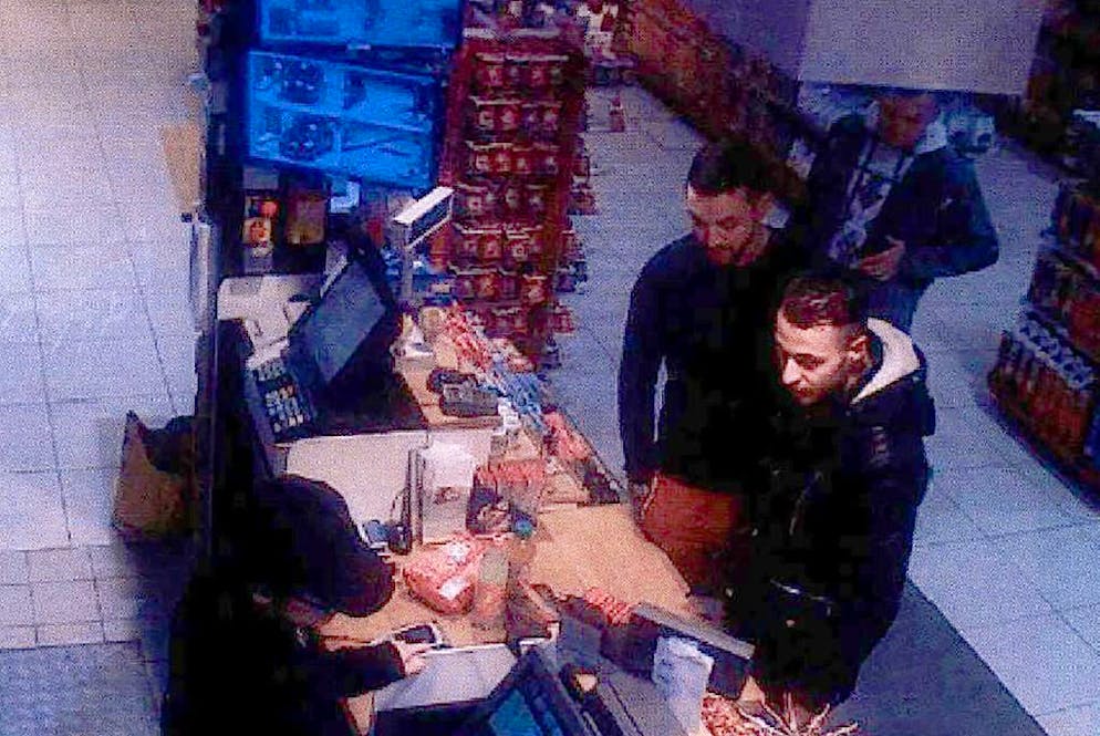 TOPSHOT - This video image taken from a CCTV camera at a petrol station in Ressons, North of Paris, on November 11, 2015 shows Salah Abdeslam (R), a suspect in the Paris attack of November 13, and Mohamed Abrini (C) buying goods.
Investigators are still seeking Salah Abdeslam, a 26-year-old Frenchman living in Belgium, who is thought to have hired the cars used by the attackers and arranged hotel apartments for the nights before the rampage and Mohamed Abrini, a 30-year-old Moroccan Belgian, suspected of having participated in scouting out the attack sites with Abdeslam.
/ AFP / OFF / - (Photo credit should read -/AFP via Getty Images)